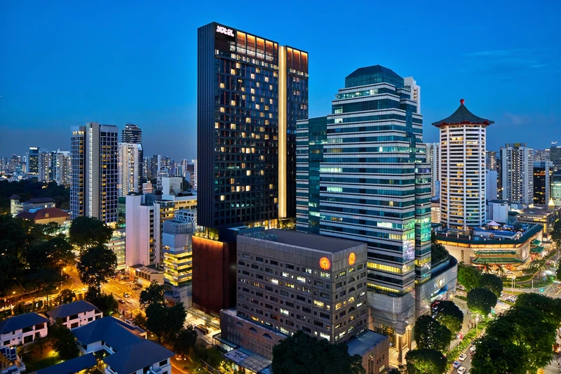 YOTEL tower at twilight within Orchard Road district skyline