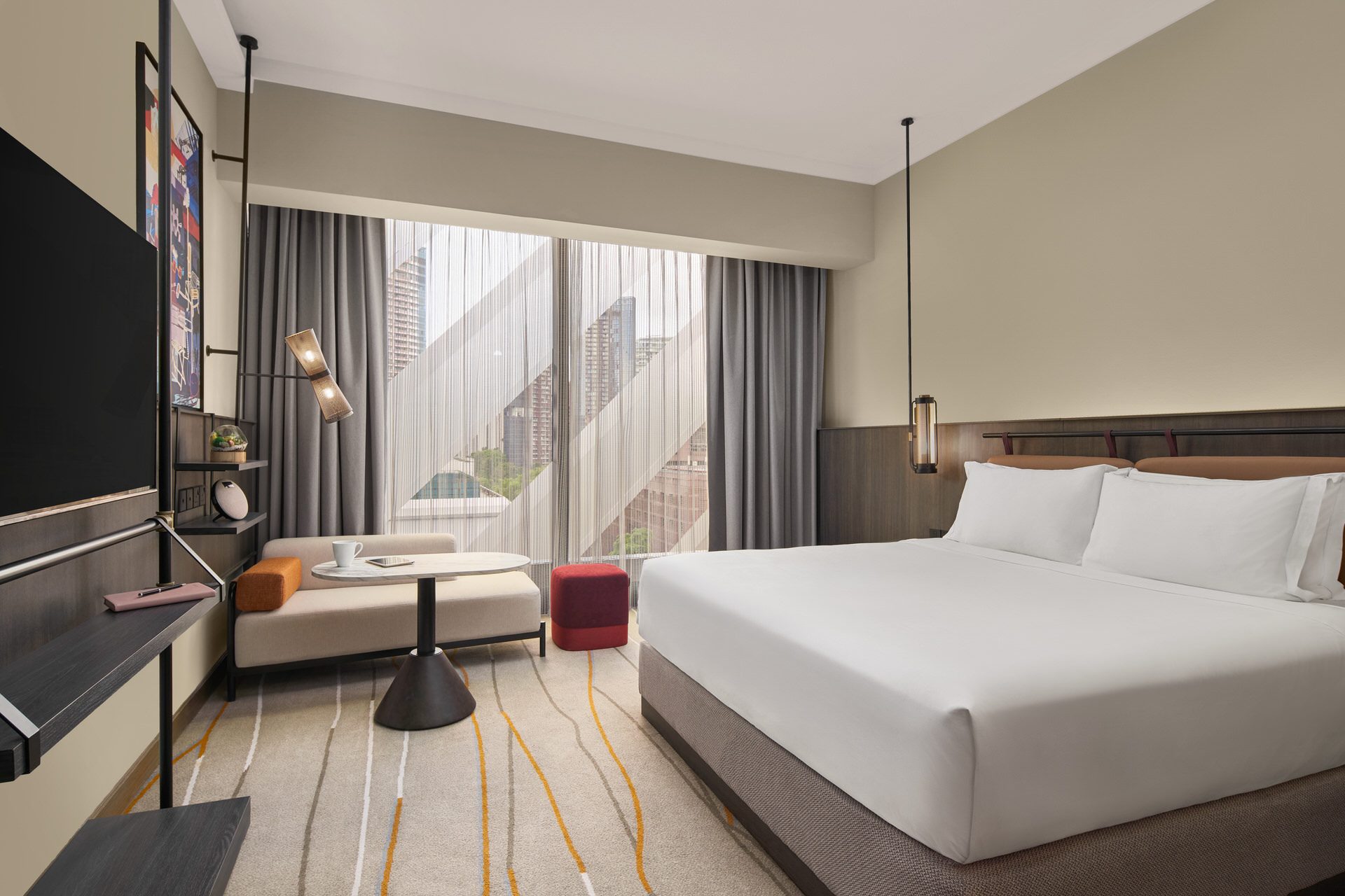 Deluxe premiere king room with closed sheers for warm ambient mood