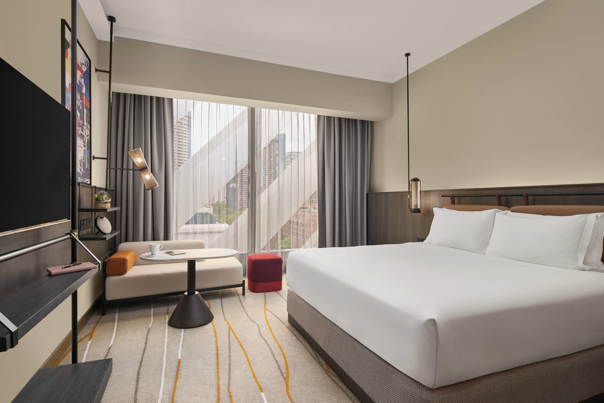 Deluxe premiere king room with closed sheers for warm ambient mood