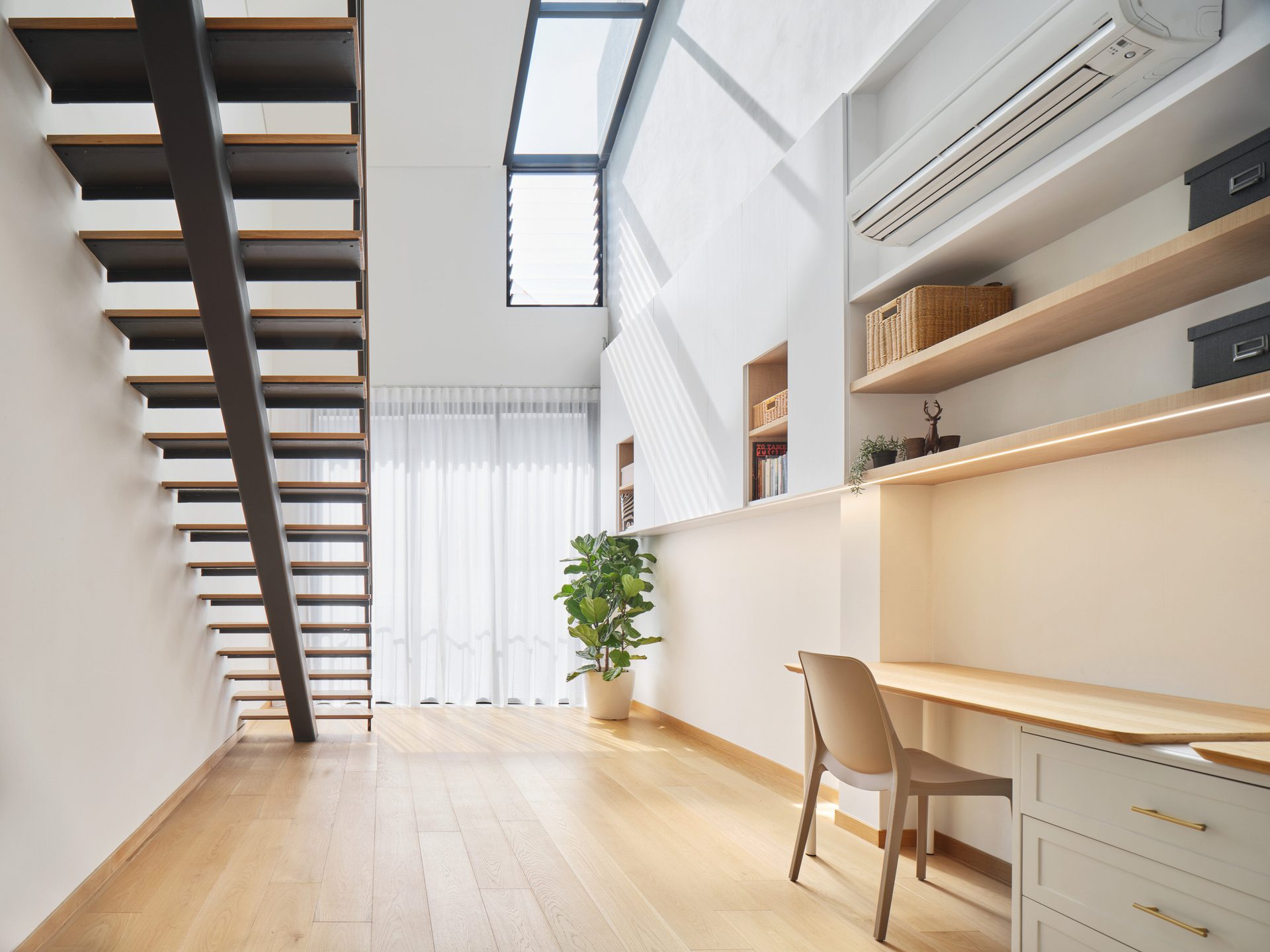 Contemporary staircase and open layout in residential interior design.