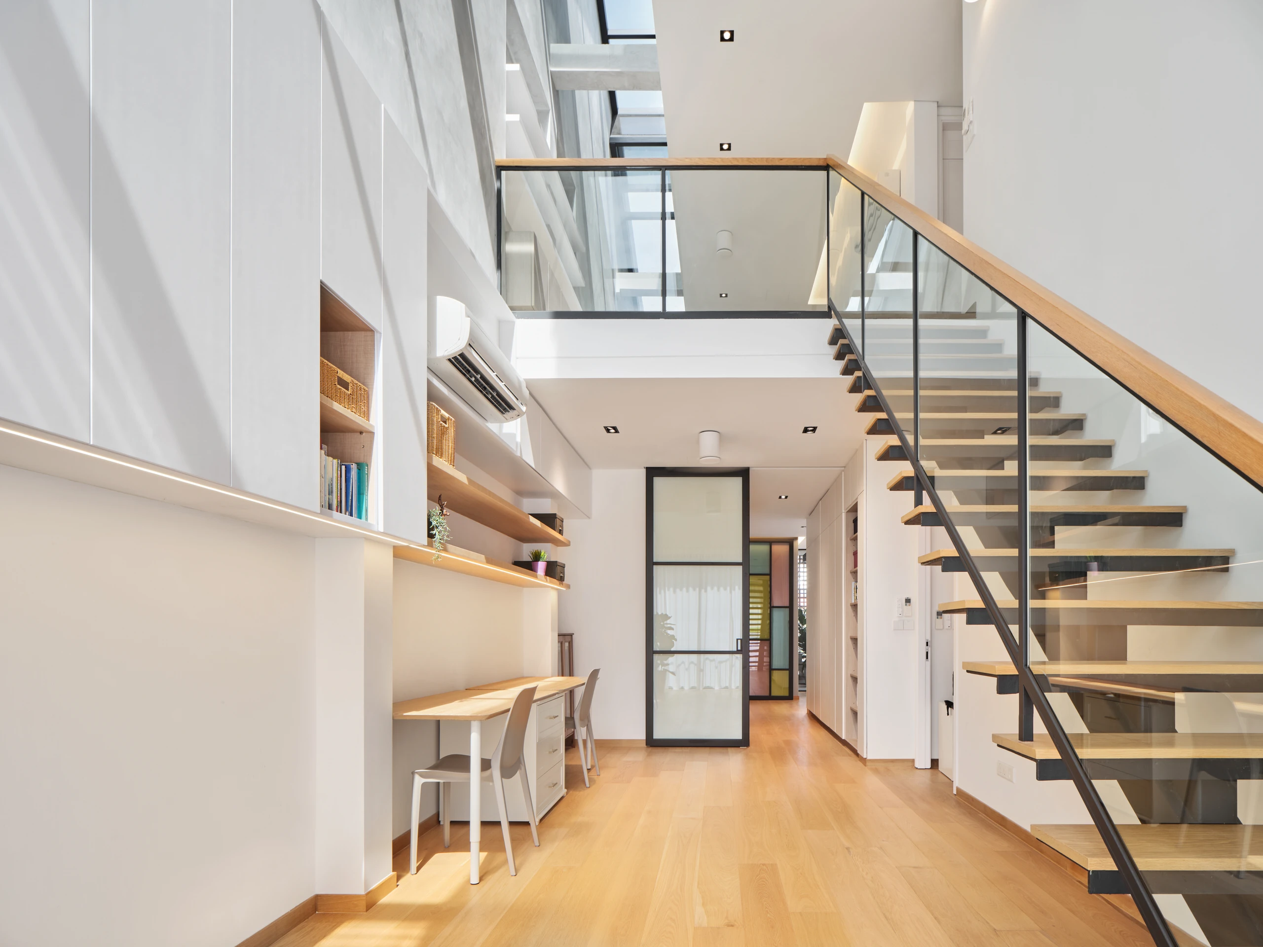 Contemporary staircase and open layout in residential interior design.