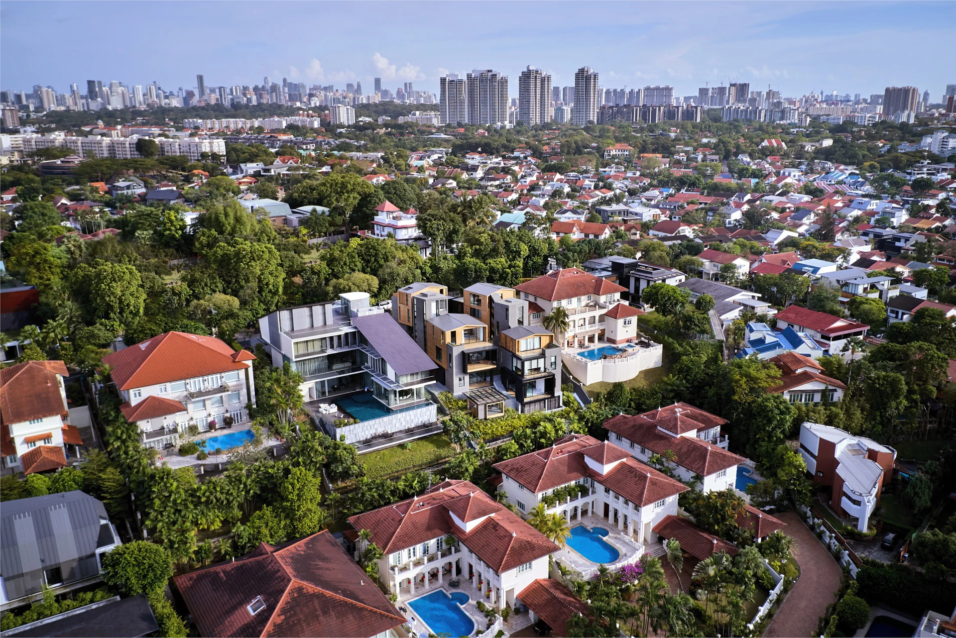 Wide aerial of suburban landscape with CBD skyline beyond
