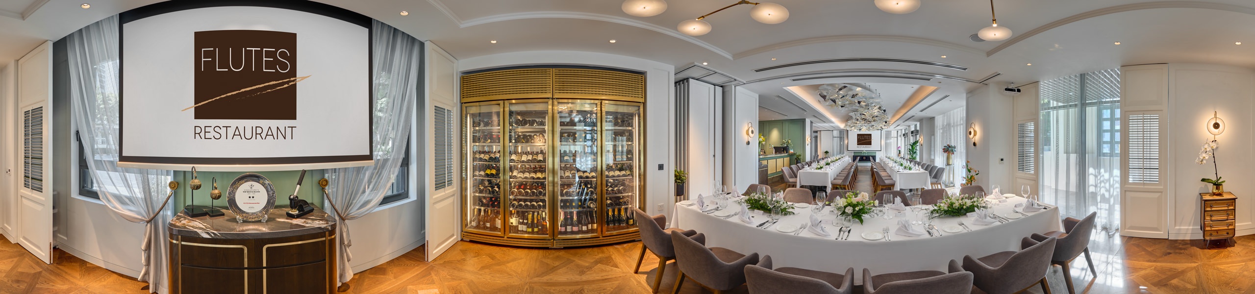360 panorama of Flutes Restaurant chambers private dining room with wine display, white tablecloths and floral centrepieces