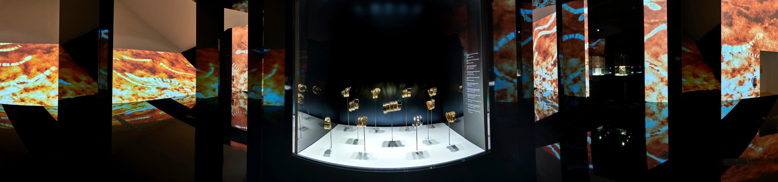360 panorama of Bulgari Serpentiform at ArtScience Museum with jewelled flower brooches suspended in glass cases and chain curtains