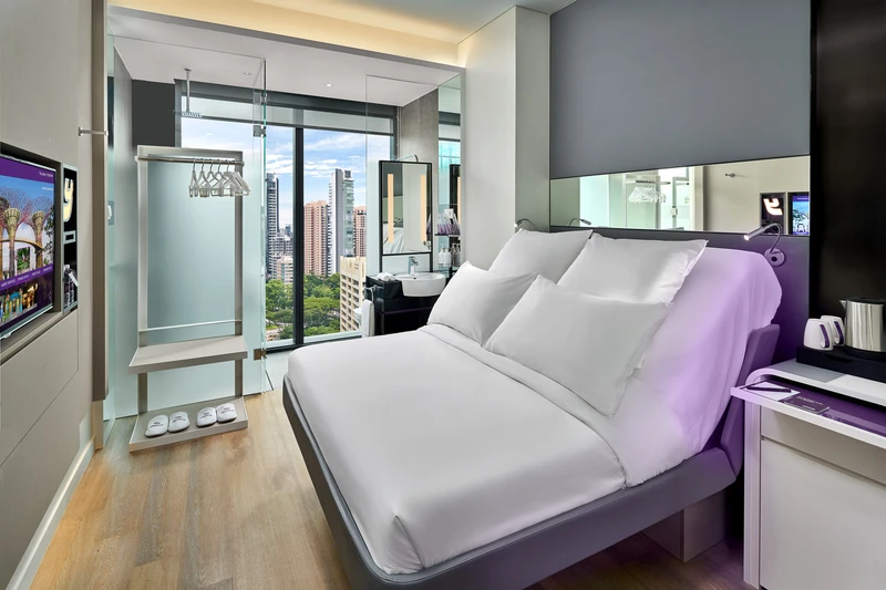 Premium cabin with rain shower, city view and purple accents