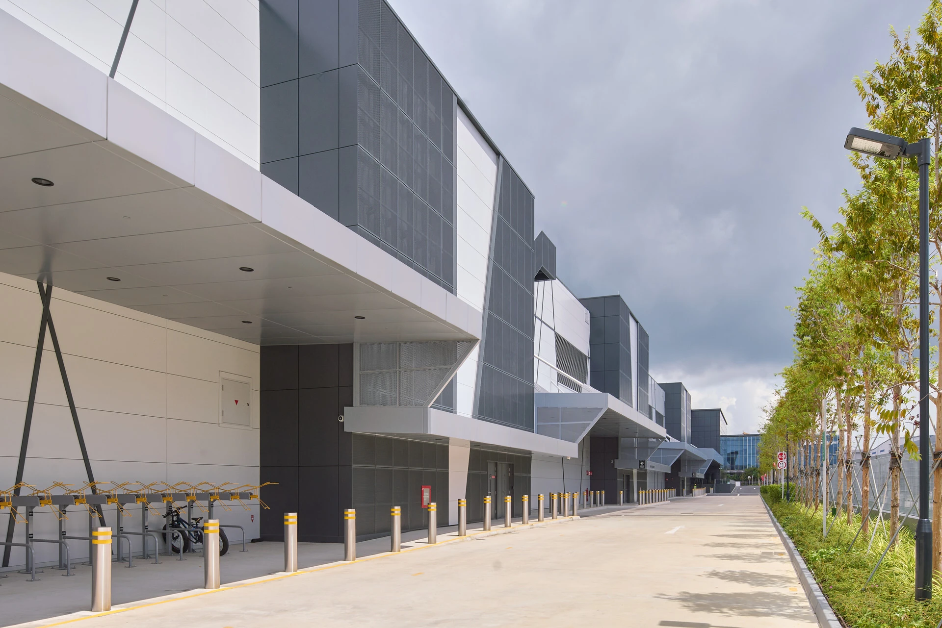 Rear elevation with repeating cladding bays, canopies and LED fixtures