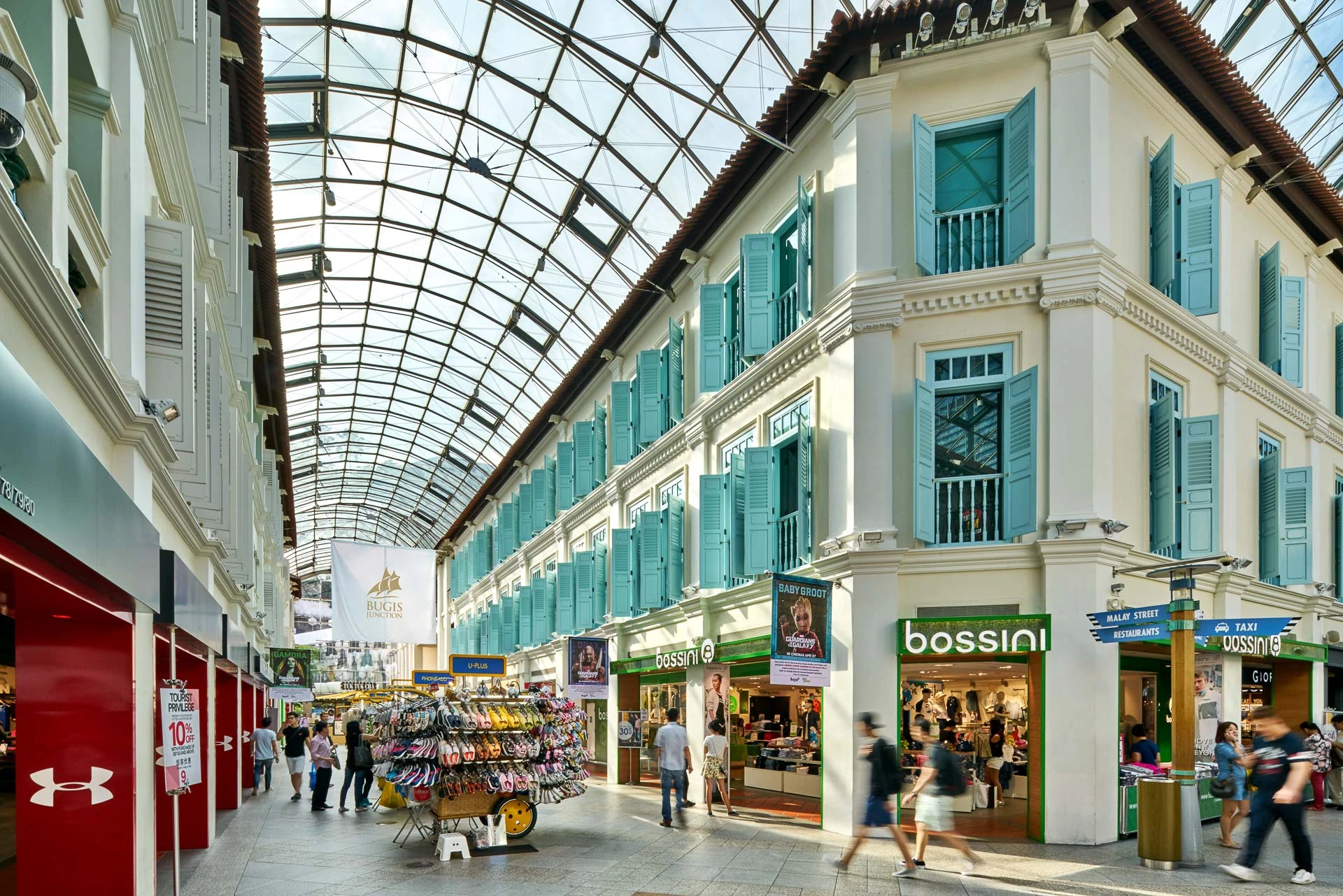 Bugis Junction Singapore glass covered galleria and heritage shophouse facades