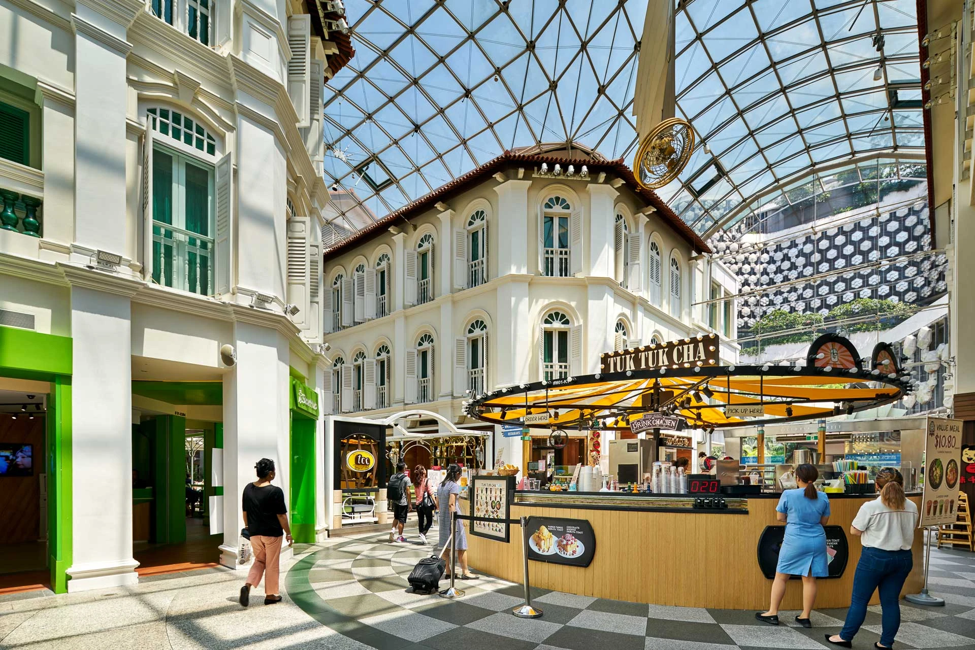 Colonial shophouse facades under glass atrium with checkered flooring - Bugis Junction Singapore architectural photography