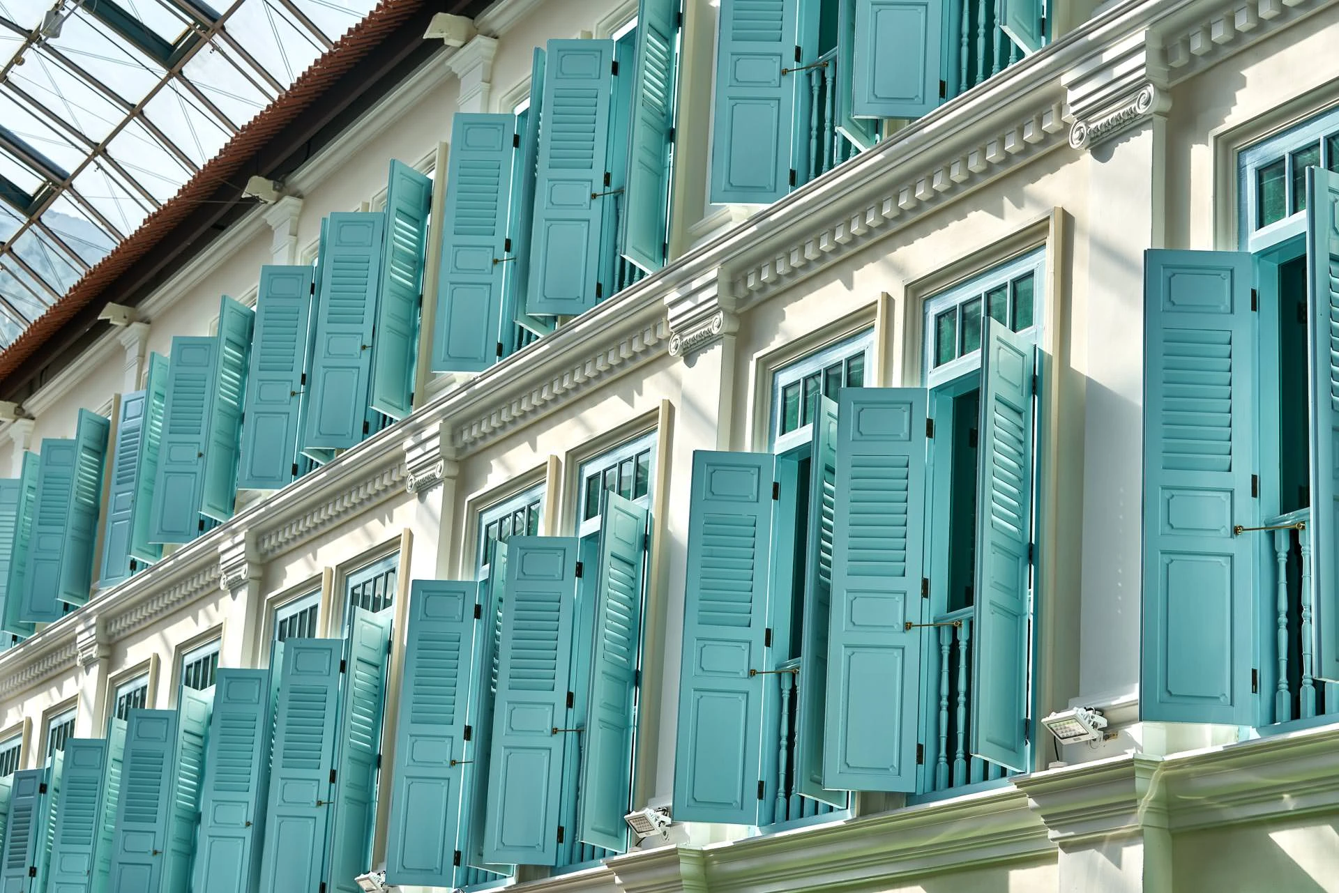 Heritage shophouse facade detail under glass canopy at Bugis Junction Singapore