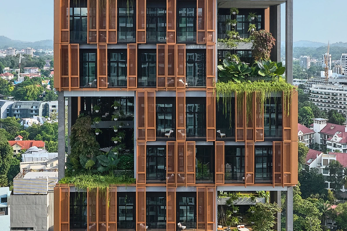 Artyzen Hotel Singapore facade detail with copper screens and cascading tropical planting