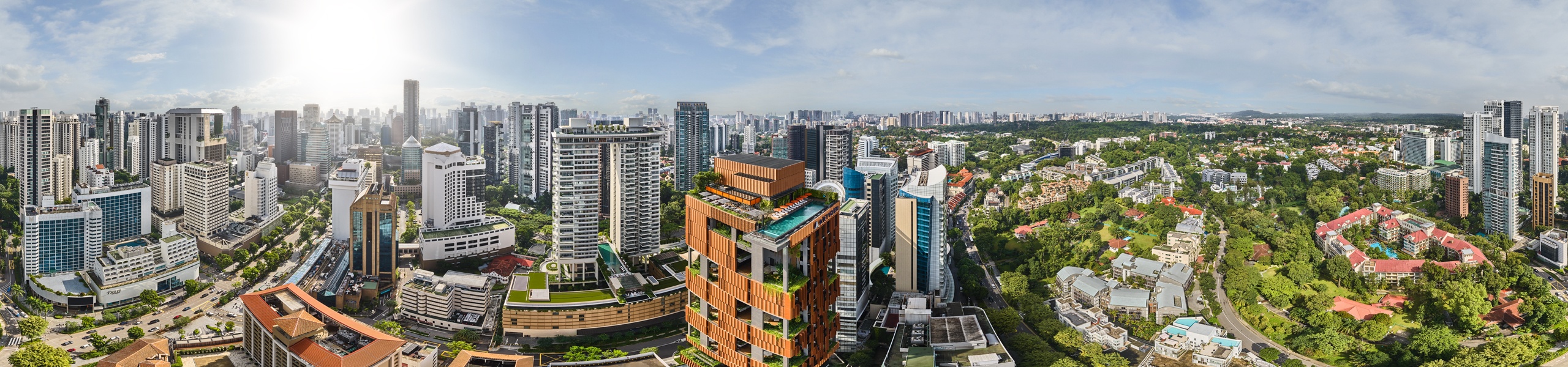 Aerial 360 panorama of Artyzen Singapore on Orchard Road with rooftop pool and surrounding skyline