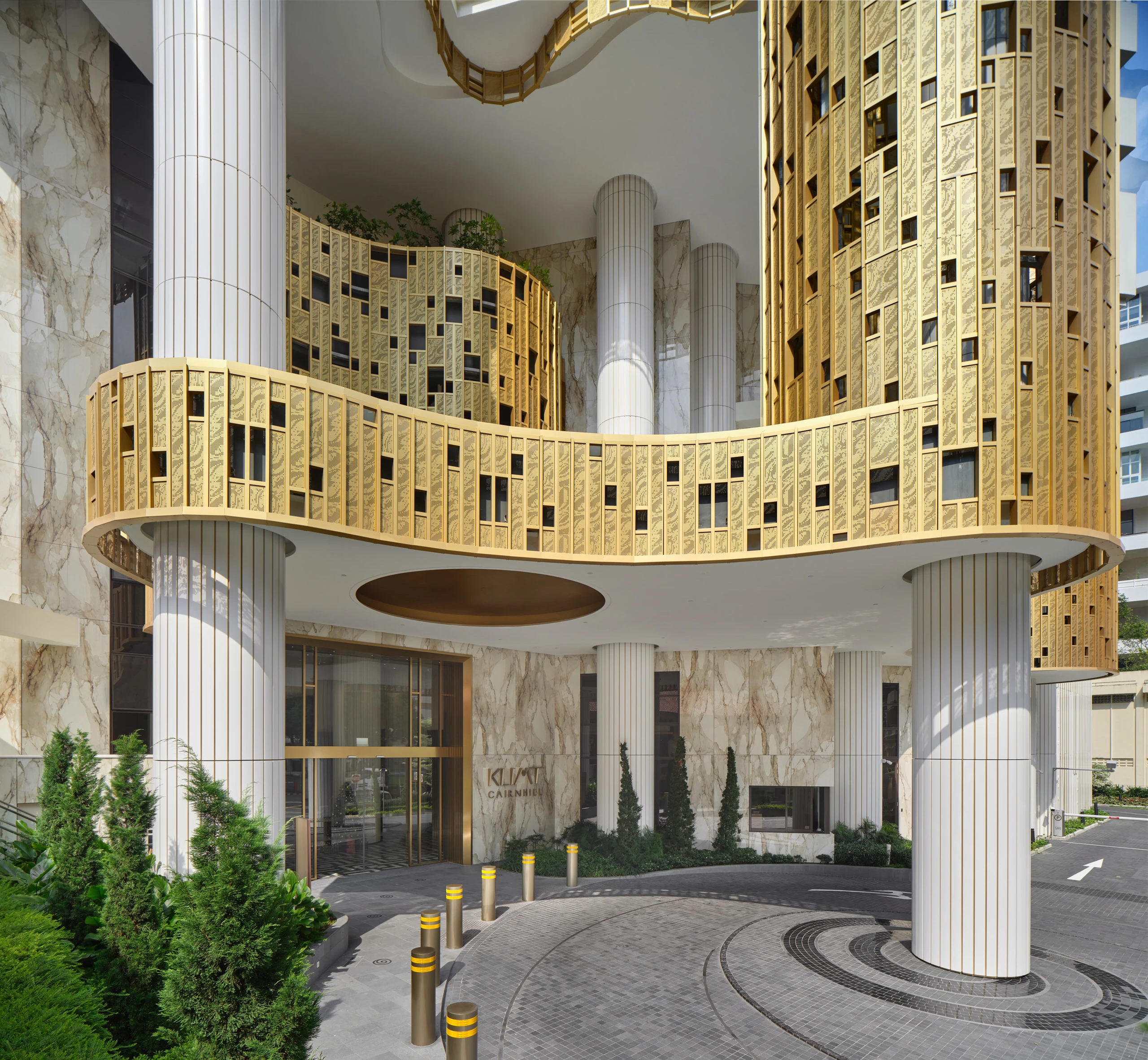 Klimt Cairnhill entrance and tower with Atlas Concorde gold mosaic tile cladding and marble-effect porcelain wall panels