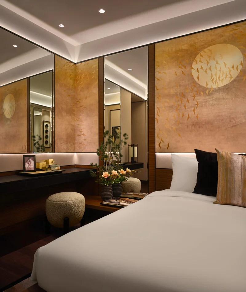 Bedroom with gold bird panels, ikebana and recessed glow