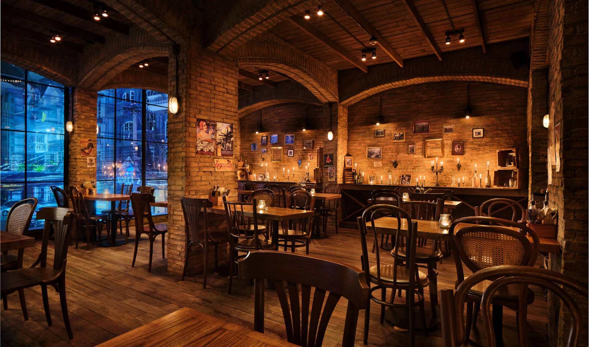 Brick arches with candle ledge, vintage gallery wall and steel windows — Cantina Bangkok interior photography