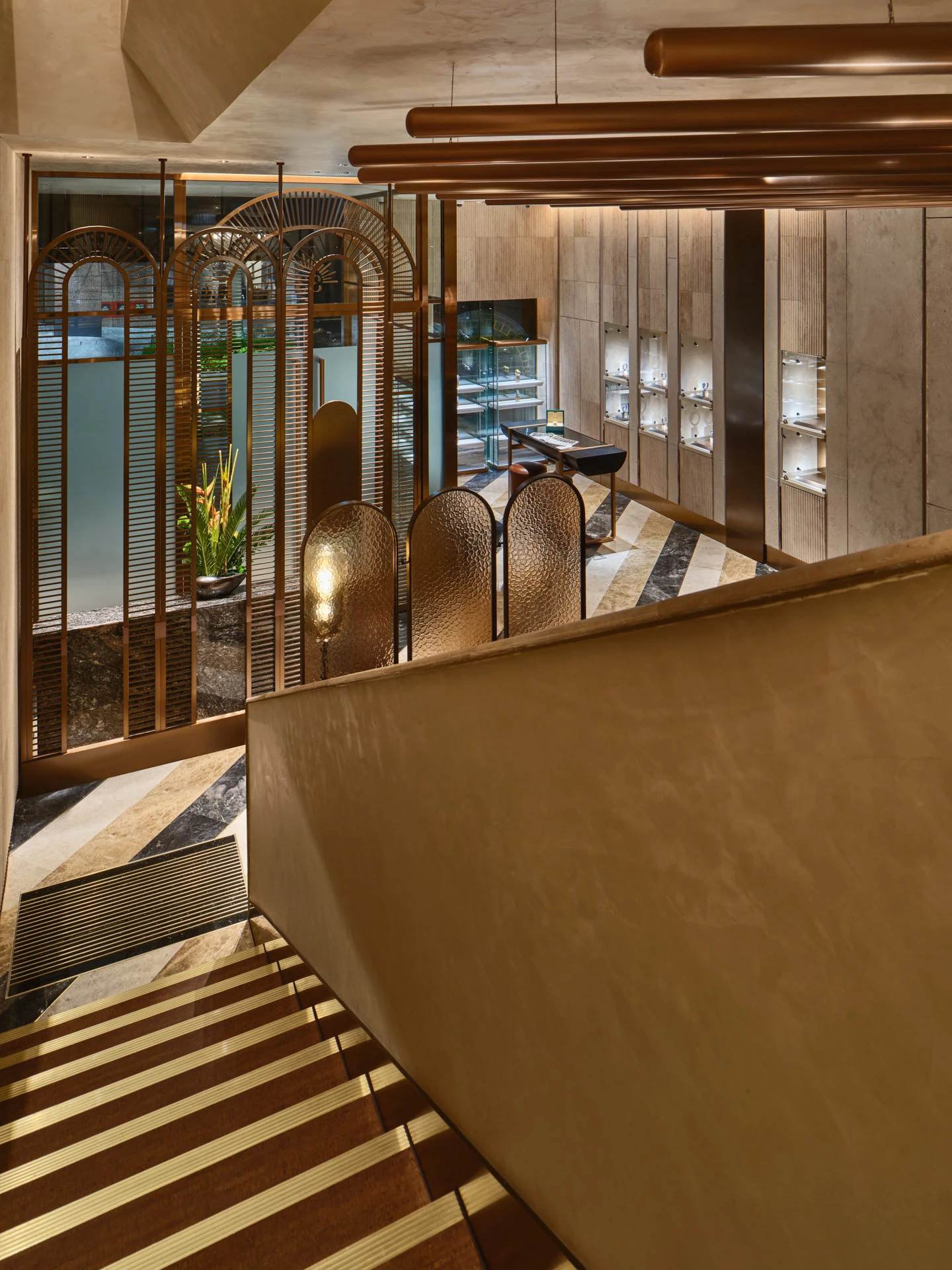 Showroom from staircase with Art Deco copper screens and chevron marble