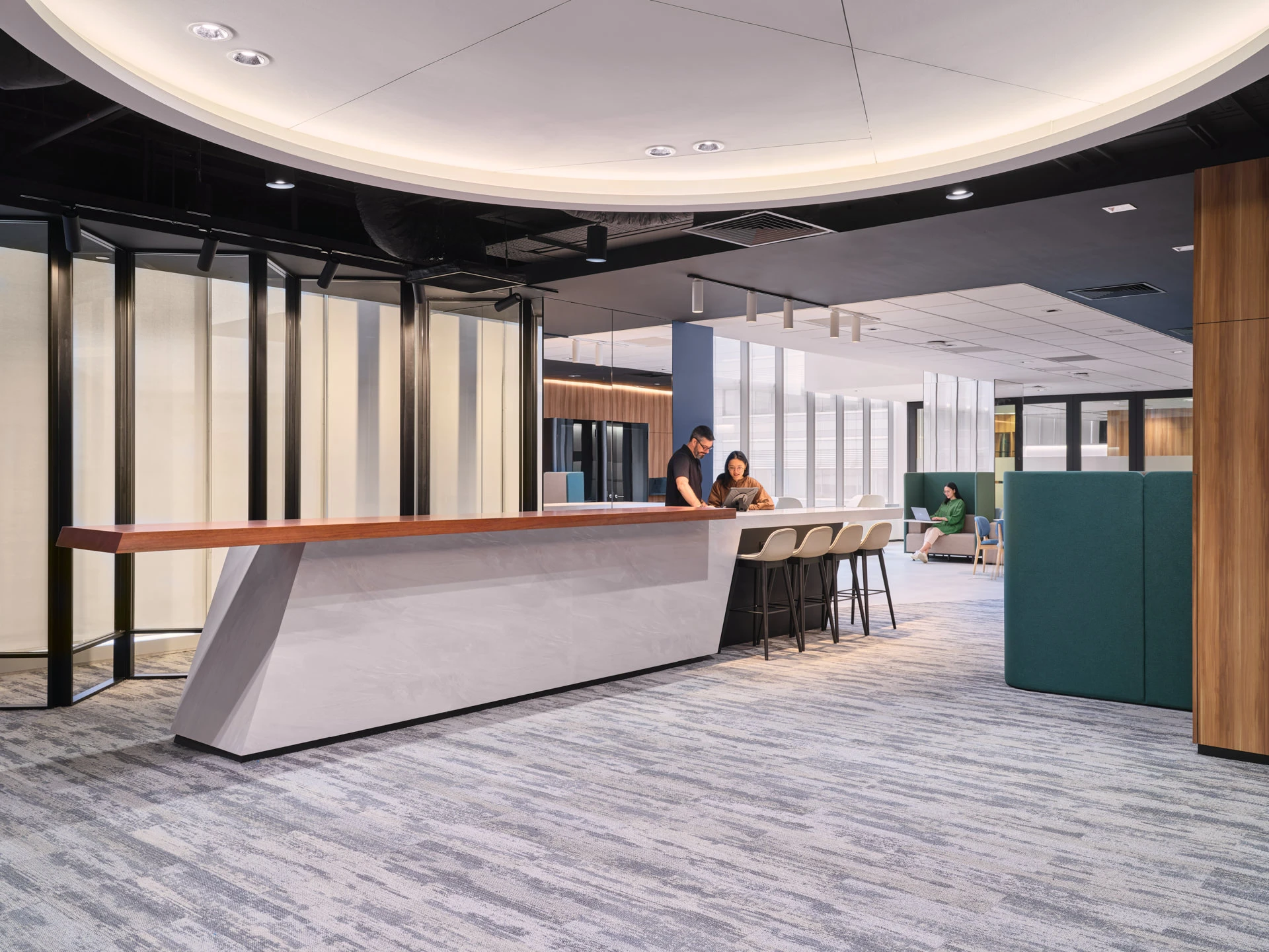 Central hub with cantilevered bar counter and circular ceiling coffer