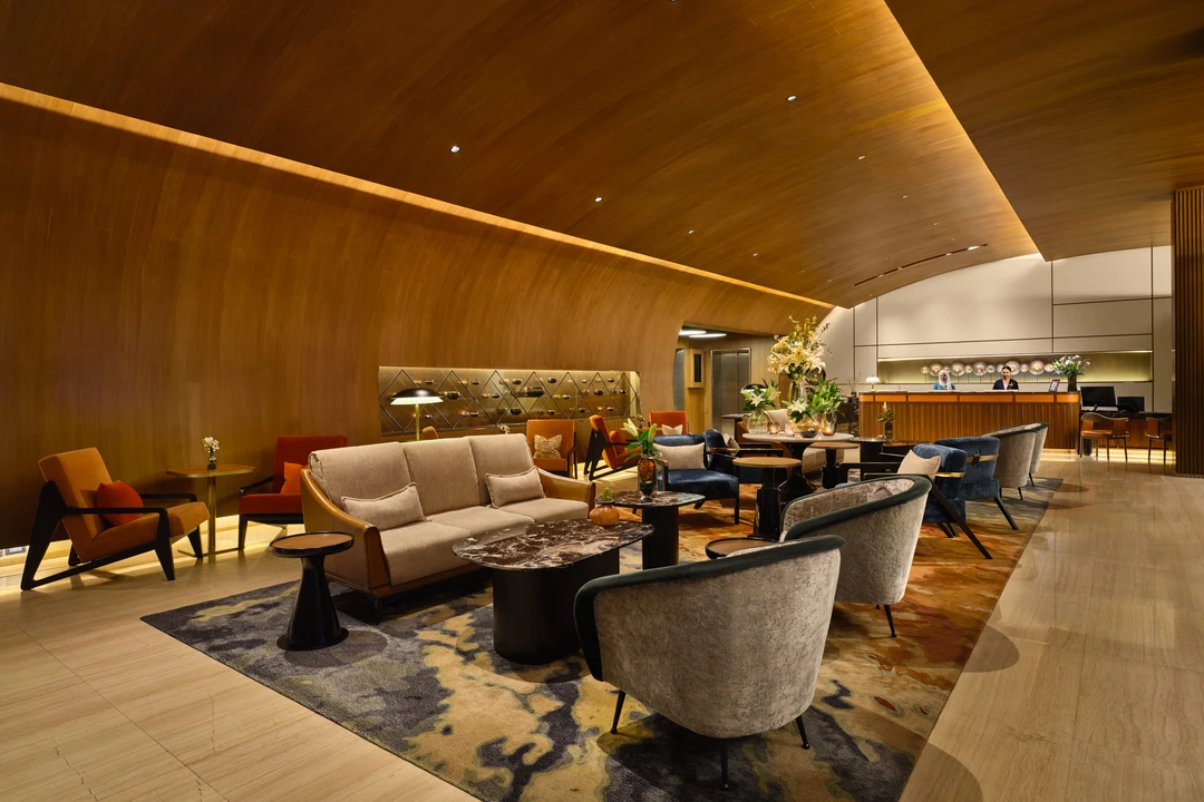 Fraser Suites Sukhumvit lobby seating area with front desk beyond
