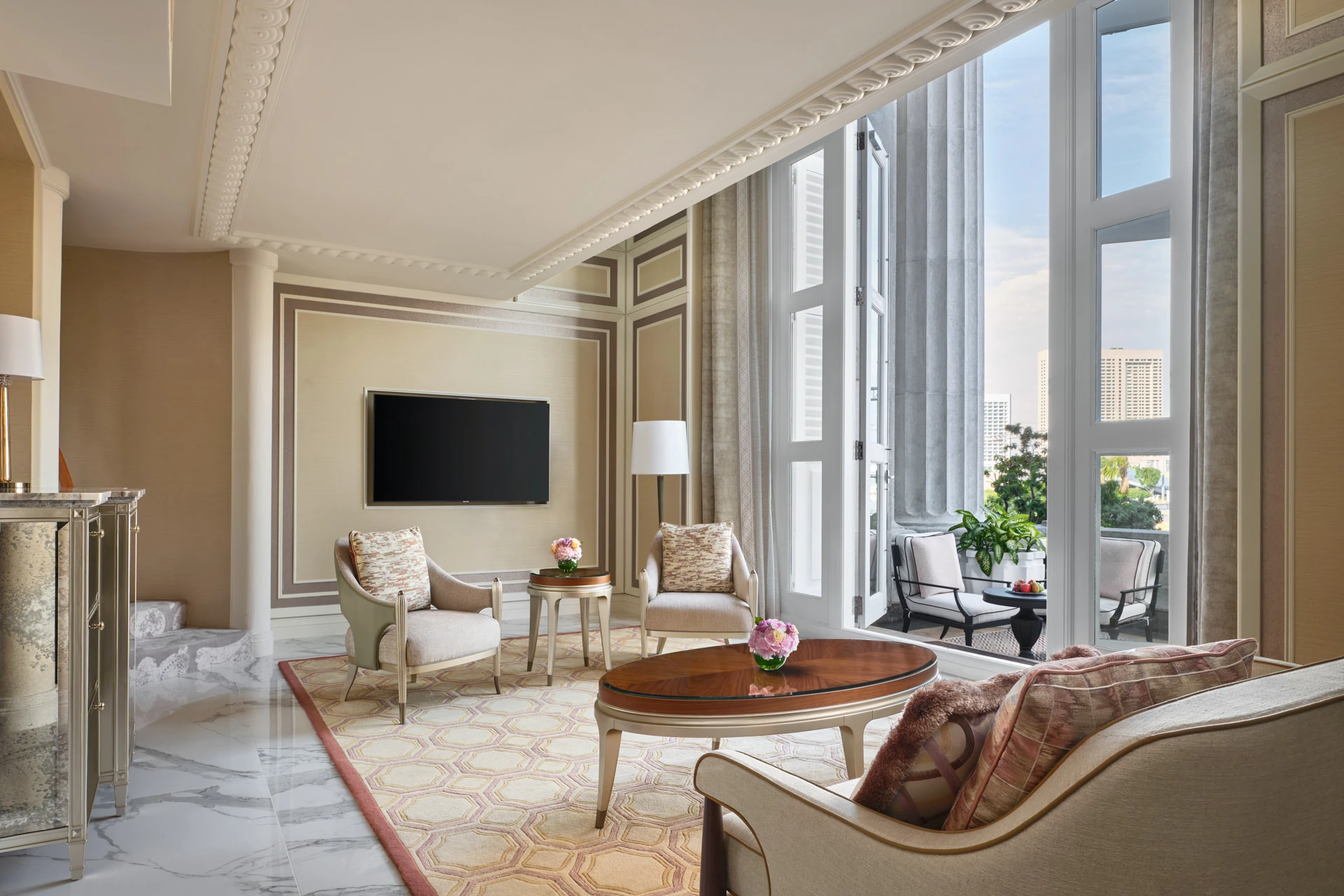 Neoclassical living room with French doors and balcony