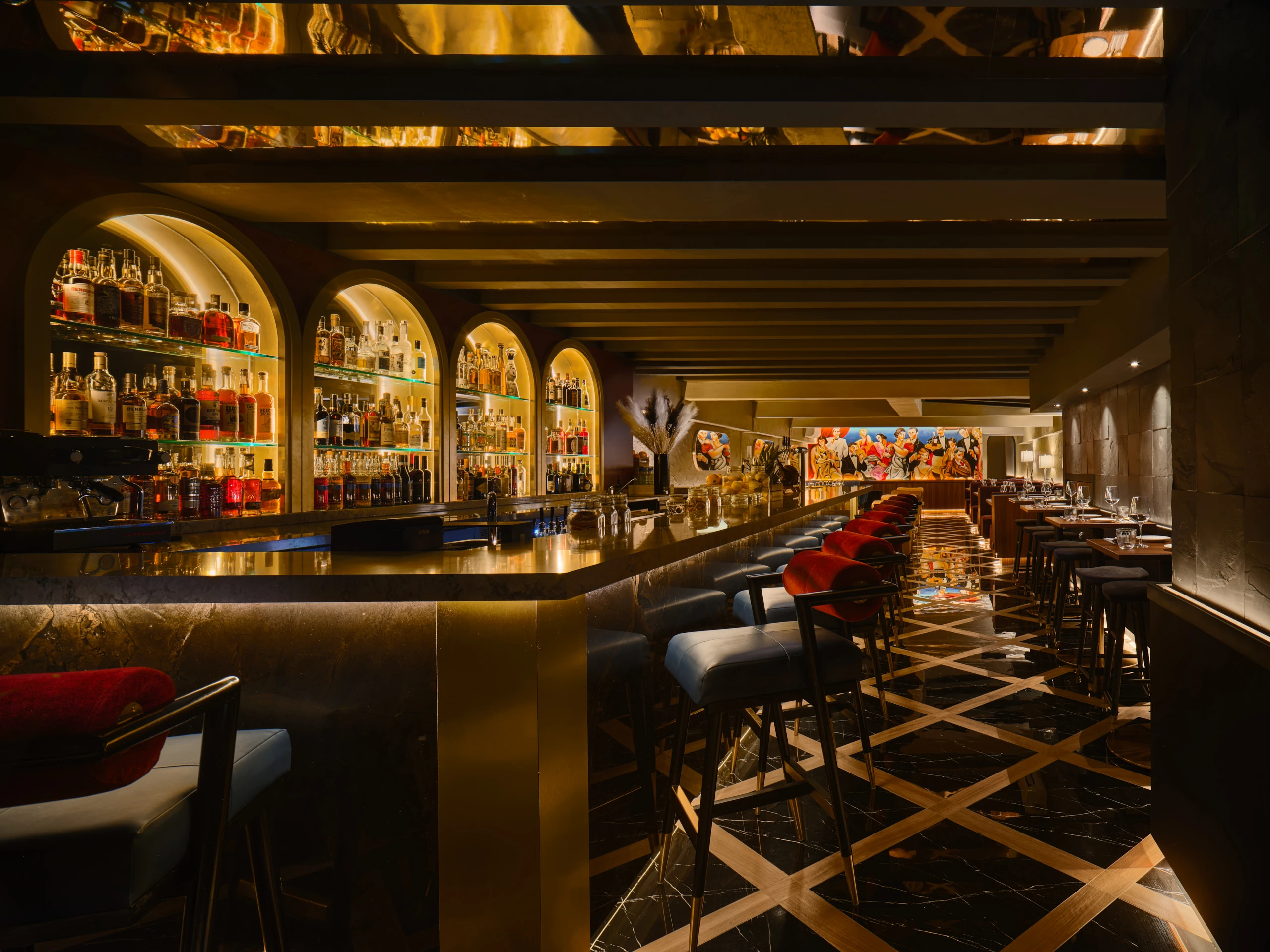 Gotti Singapore luxurious bar with gold-lit arches, extensive liquor display and plush seating