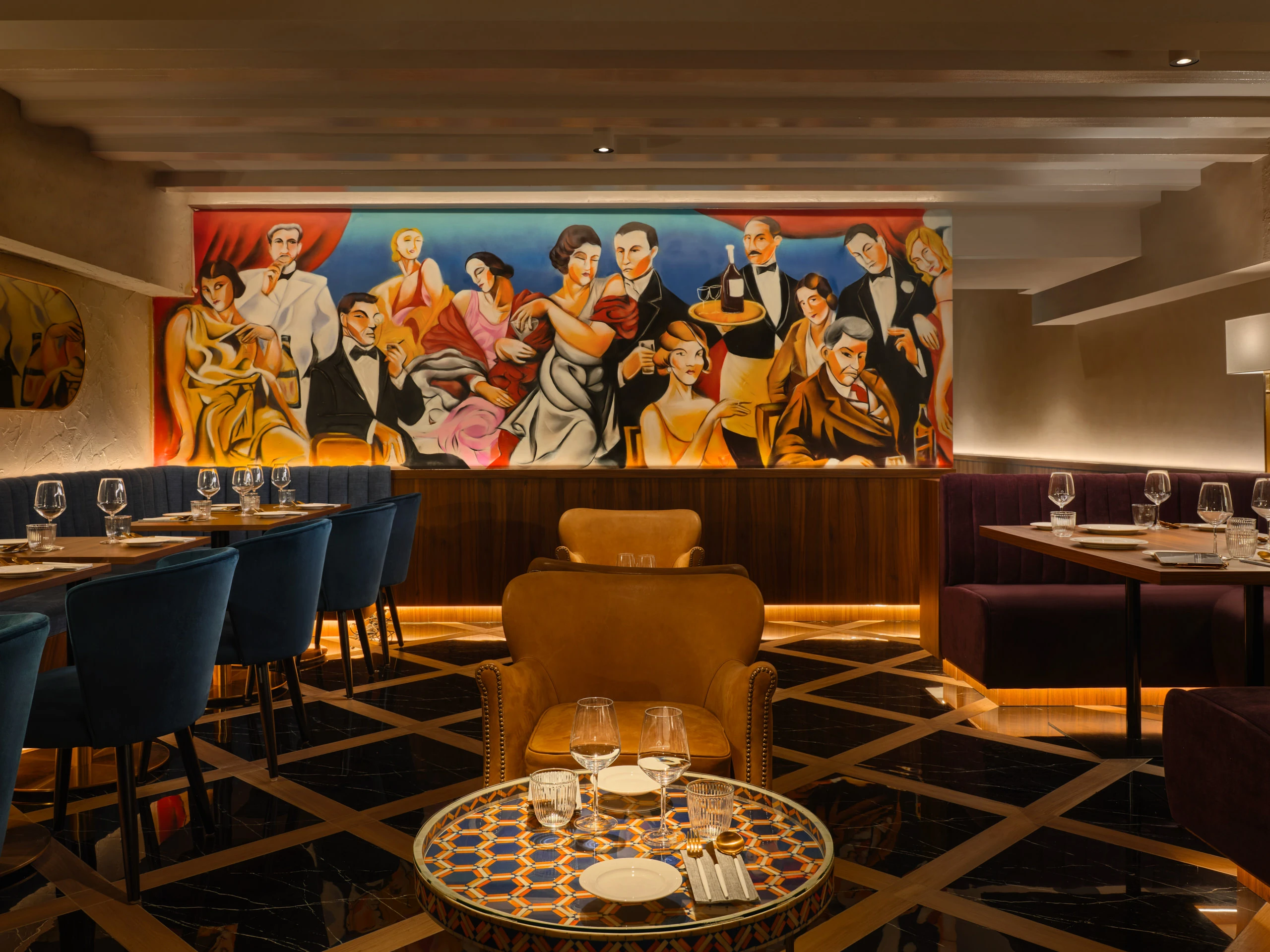 Gotti Singapore dining area with vibrant mural backdrop and luxurious seating