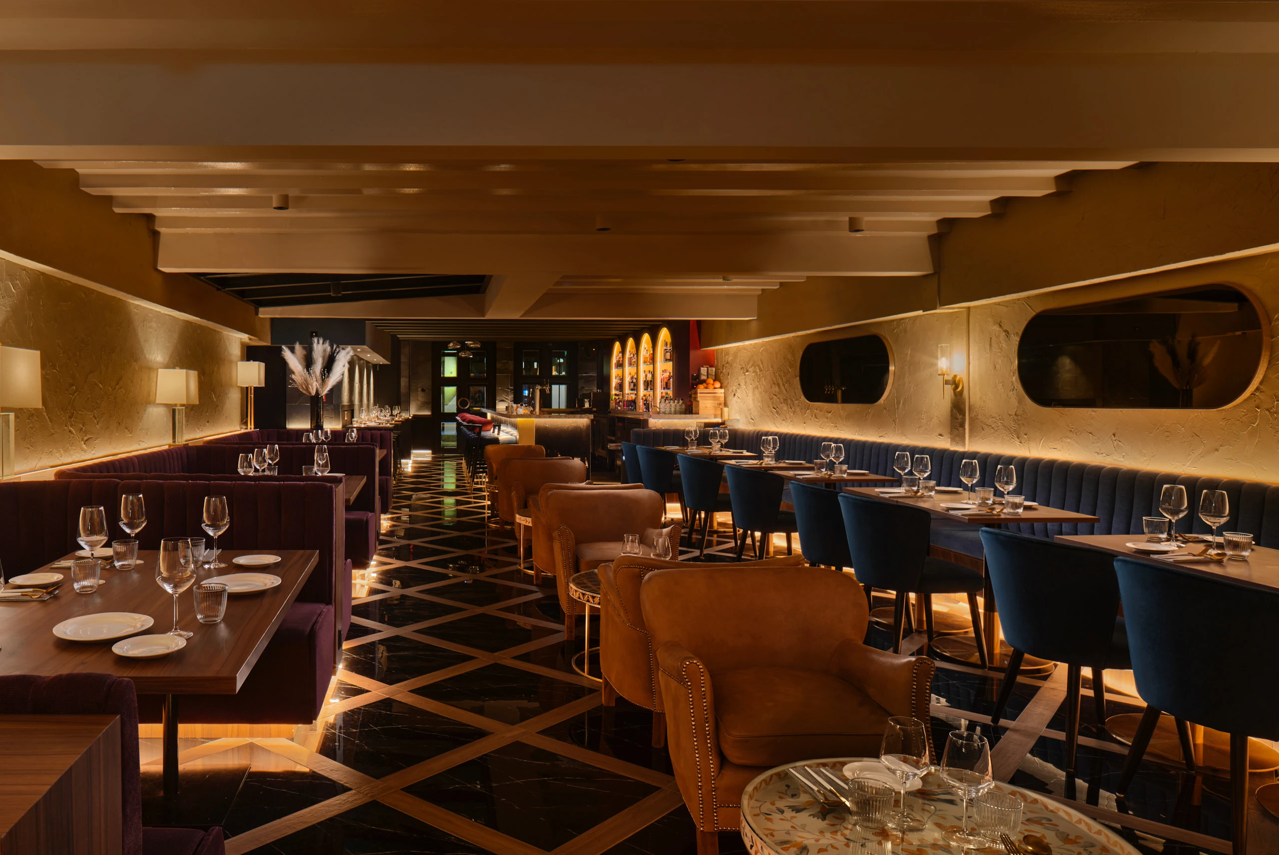 Gotti Singapore dining room with elegant lighting, patterned flooring and warm ambiance