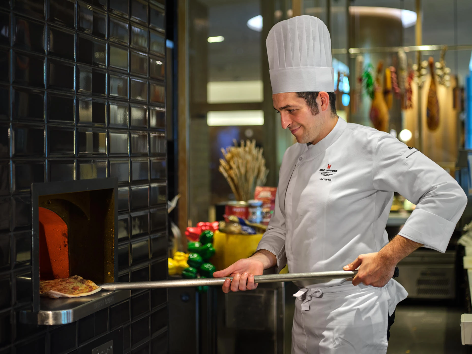 Grand Copthorne Waterfront Hotel Singapore chef with pizza