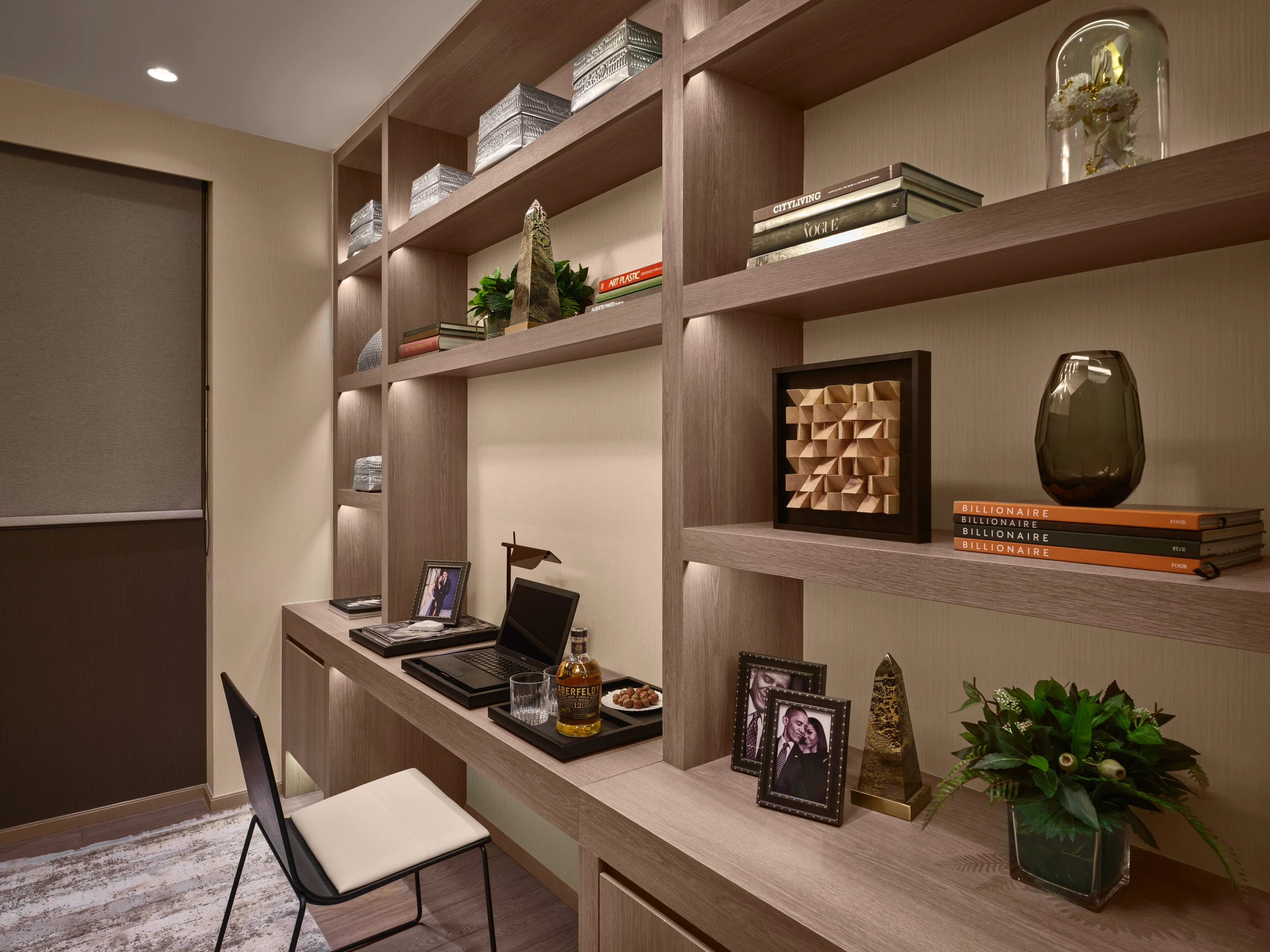 Study room with built-in desk, open shelves, and decorative accents in Klimt Cairnhill 2-bedroom show suite