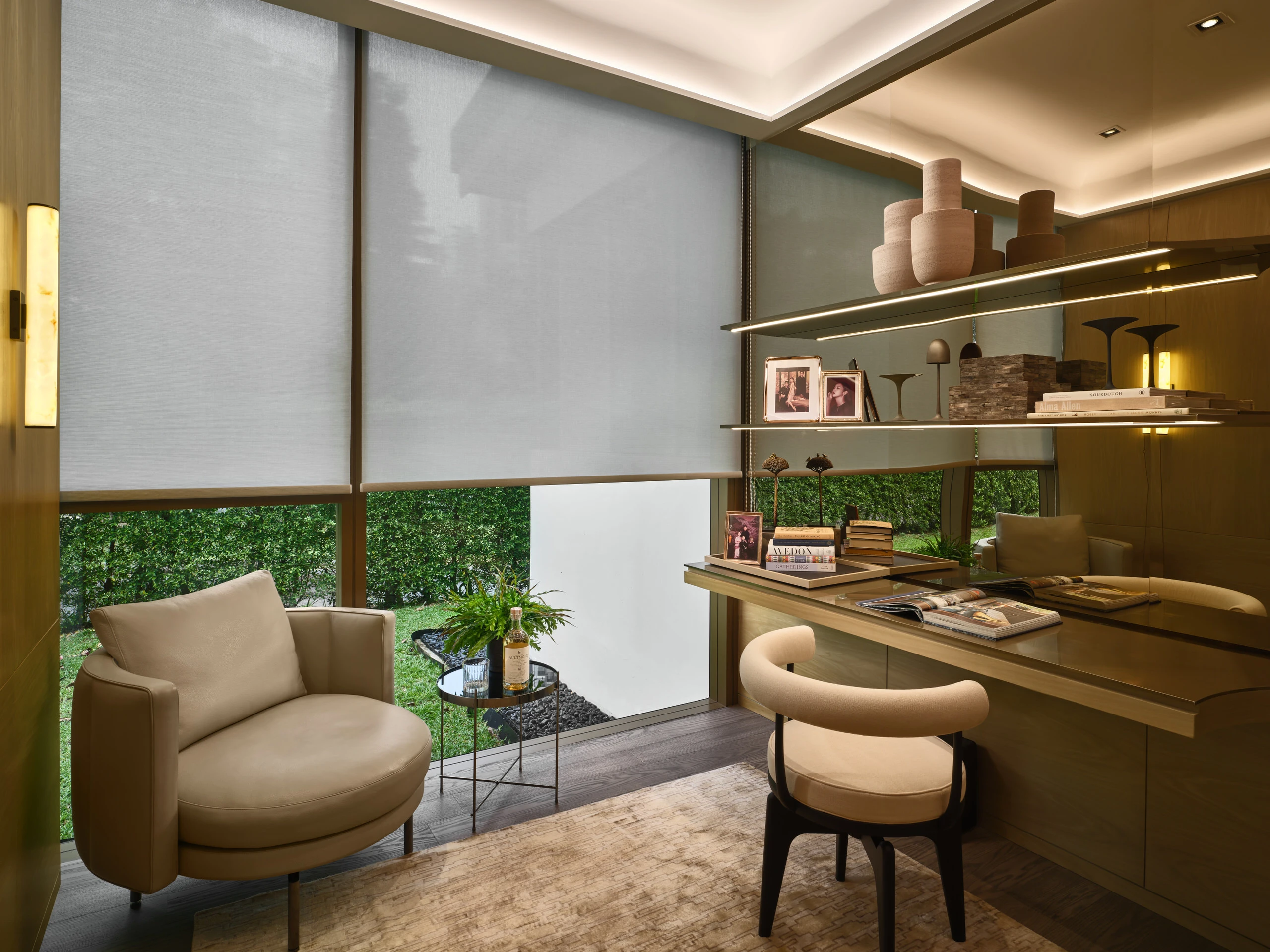 Home office with built-in desk, open shelving, and warm wood finishes in Klimt Cairnhill 3-bedroom showflat