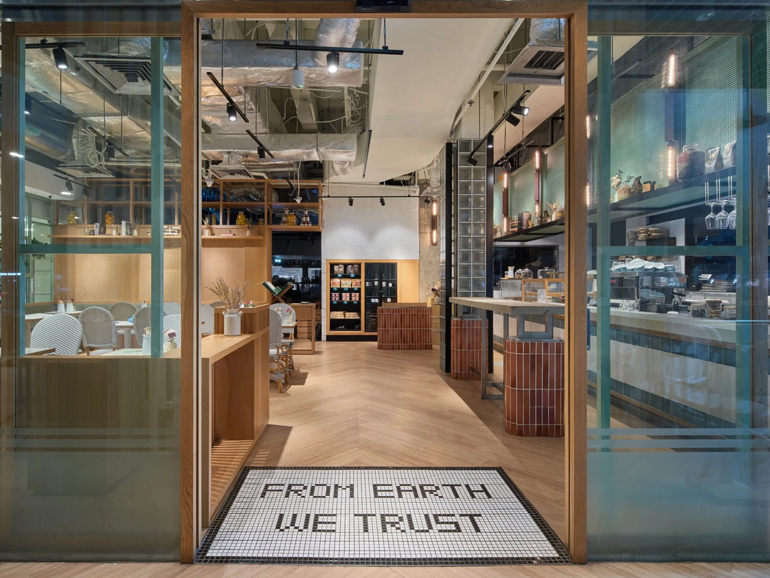 Entrance detail with glass doors and welcome mat