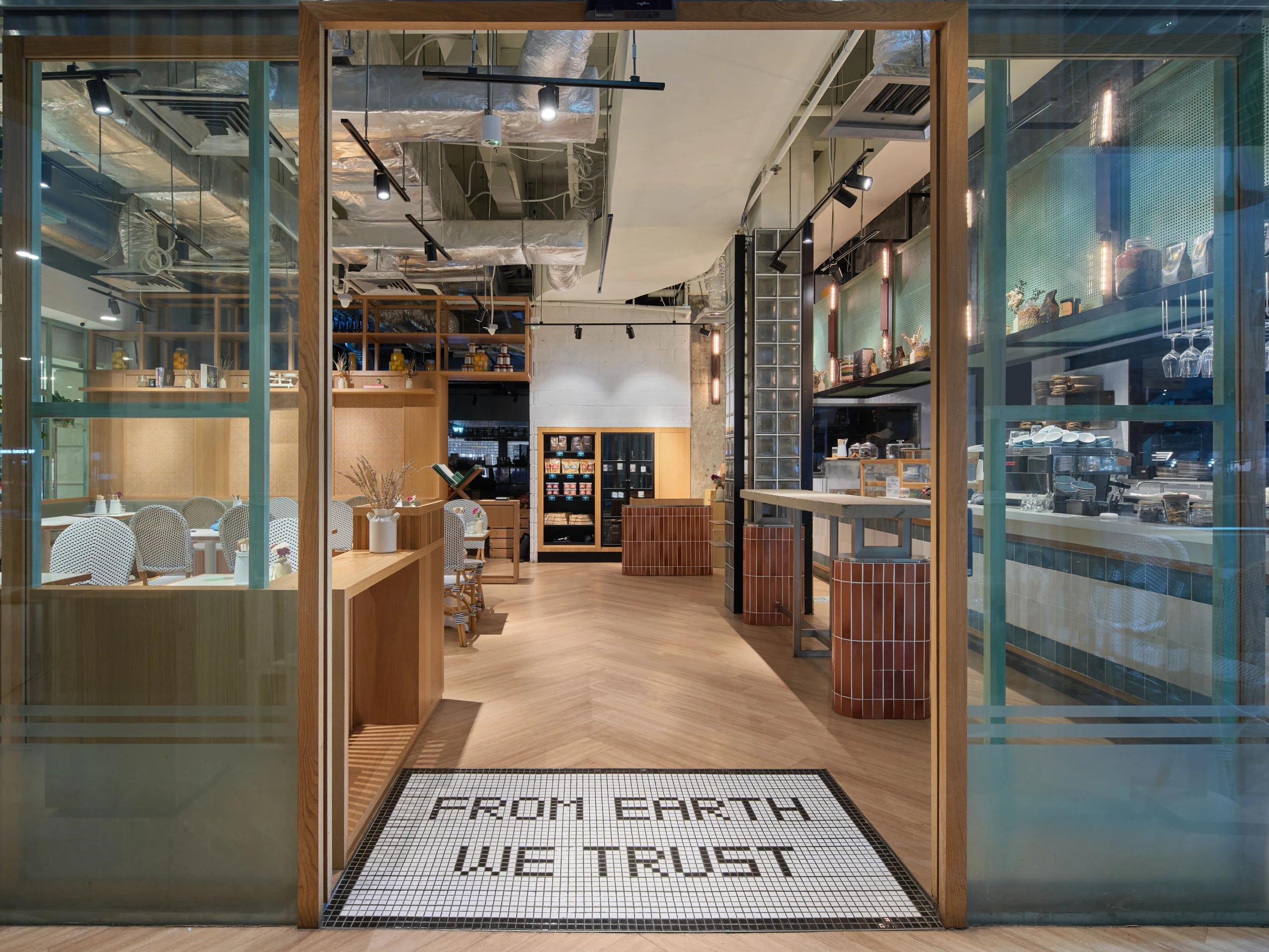 Entrance detail with glass doors and welcome mat