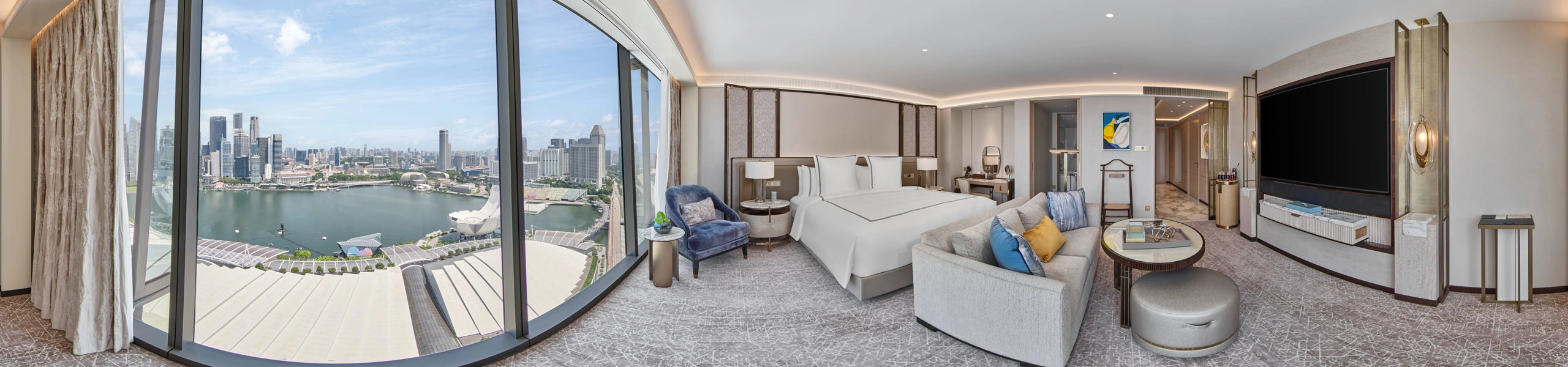 360 panorama of Marina Bay Sands premier studio with king bed, sofa and Marina Bay city skyline views