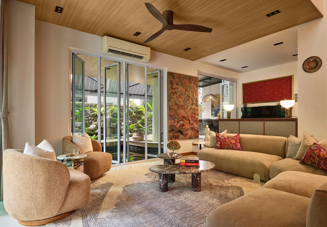 Serangoon Chuan Drive living room by Nidhi Jain with beige sectional sofa, timber ceiling, terrace doors and red accent wall
