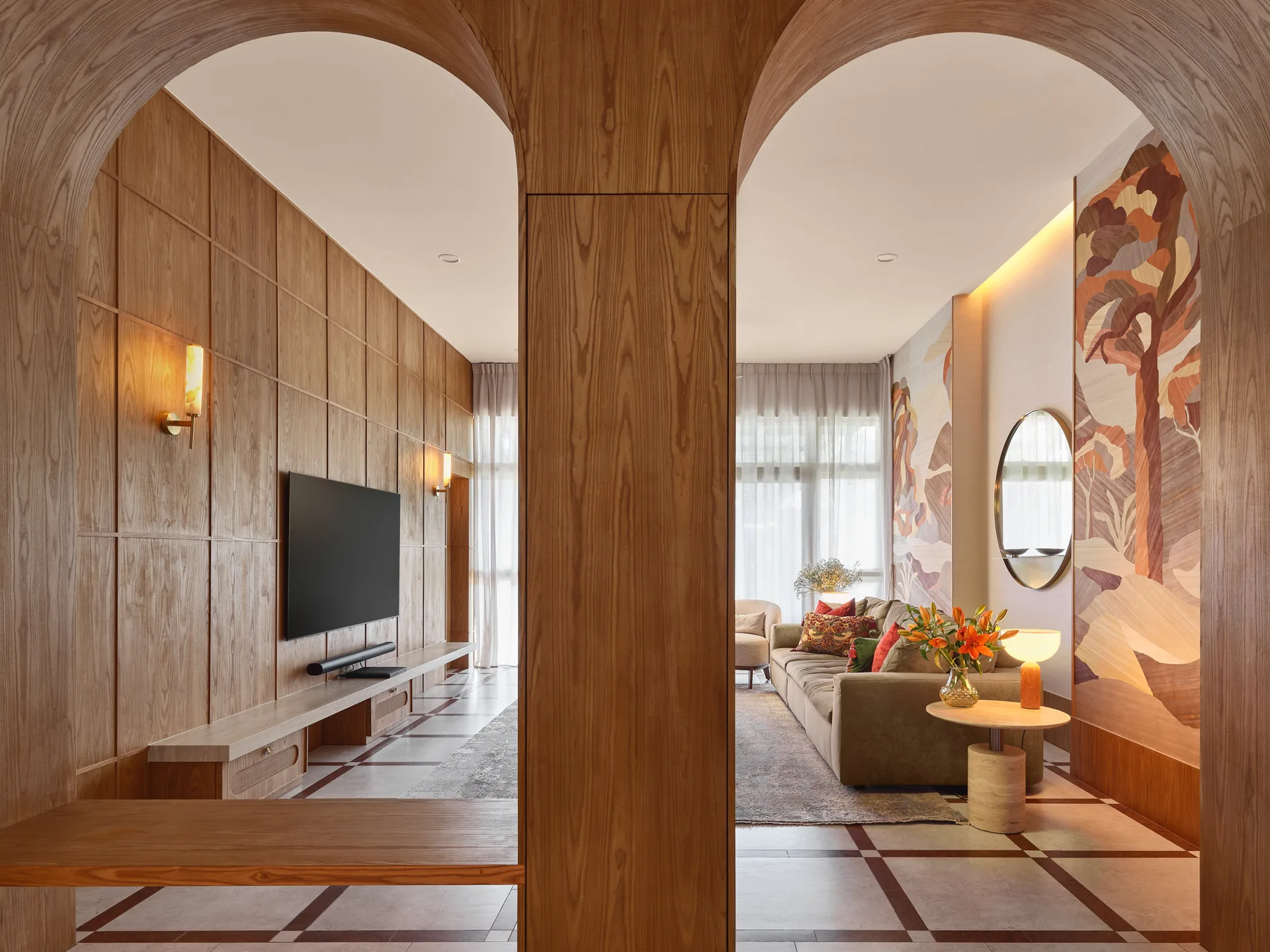 Bayshore residence by Nidhi Jain with timber arch portals framing the living and dining areas, crop detail