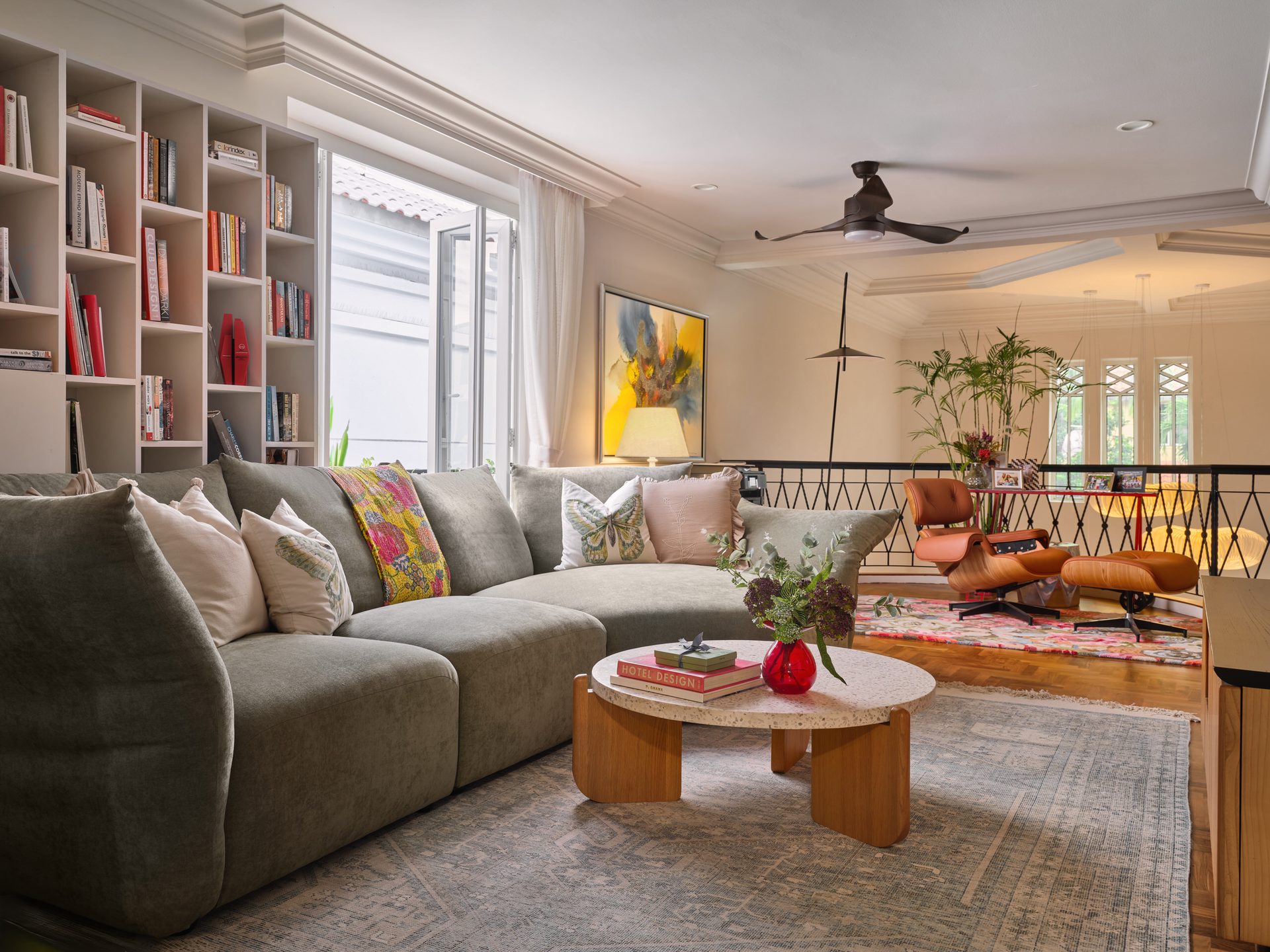 Lounge with neutral sofa, wooden coffee table and colourful wall art
