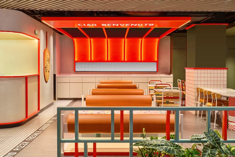 Leather banquette booths under red illuminated ribbed canopy at PastaMania Causeway Point