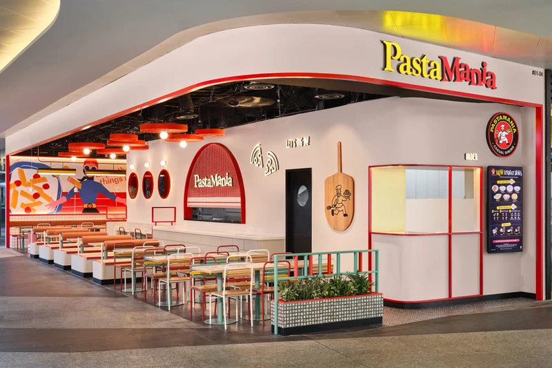 White canopy storefront with red trim and alfresco dining planters at PastaMania Fusionopolis