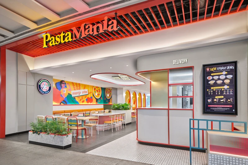 Sculptural red Ciao Benvenuto ceiling light fixture at PastaMania Jem