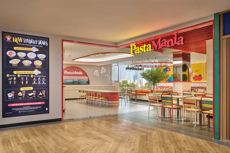 Mall storefront entrance with red signage, digital menu and olive tree interior at PastaMania Northpoint