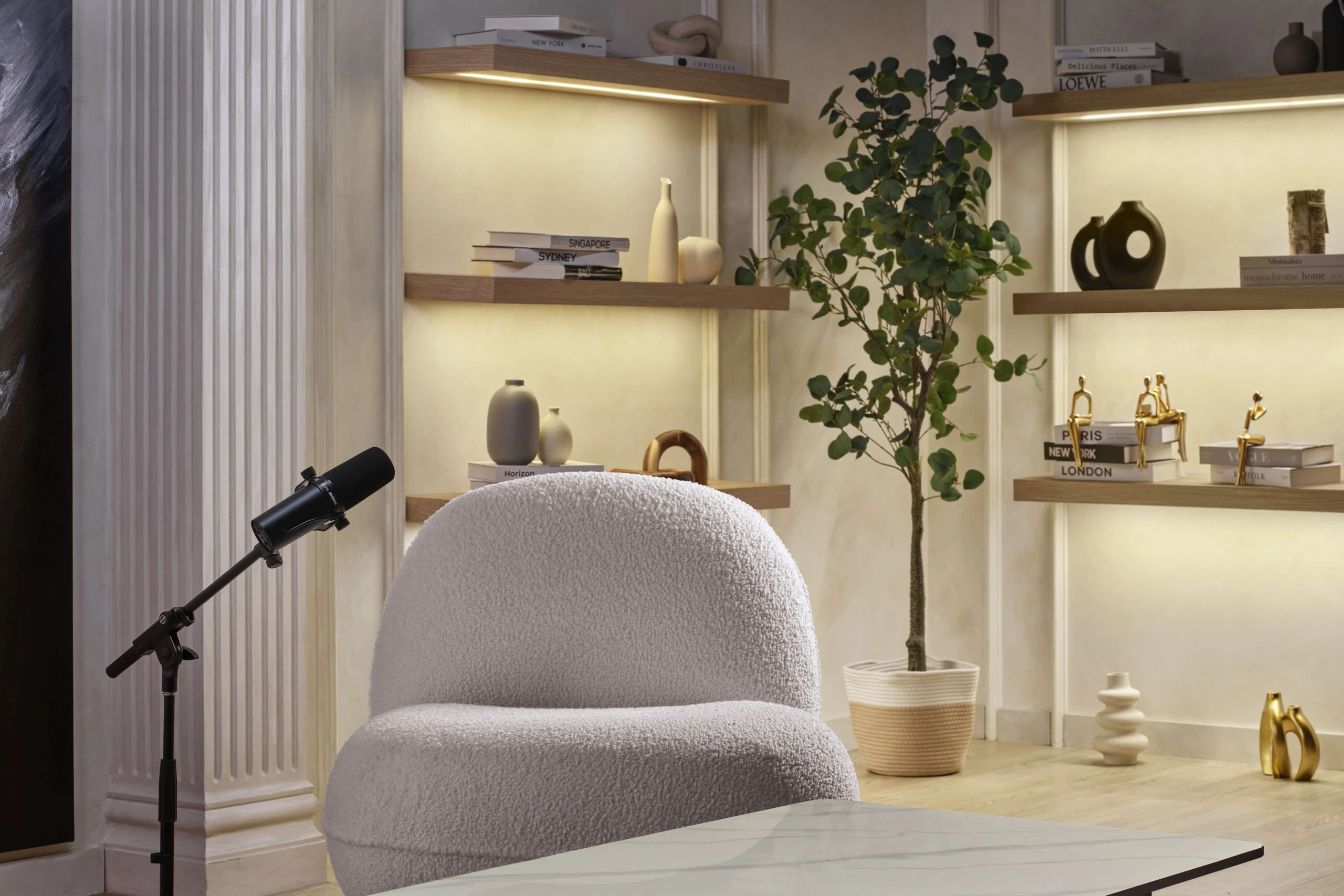 Glam studio detail with marble table, microphones and abstract art