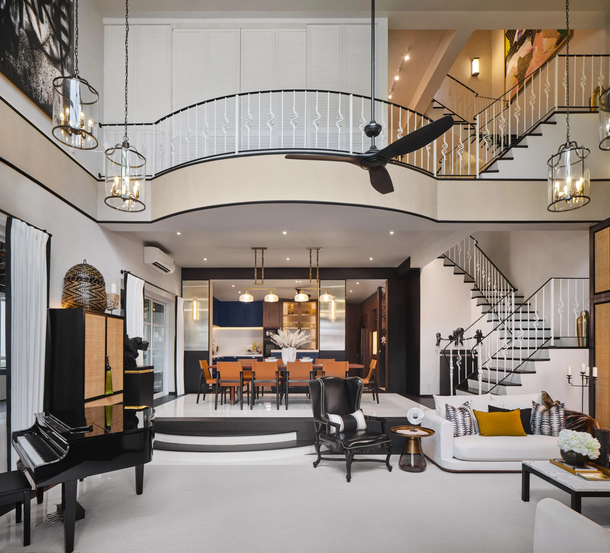 Double-height living space with modern staircase and open floor plan