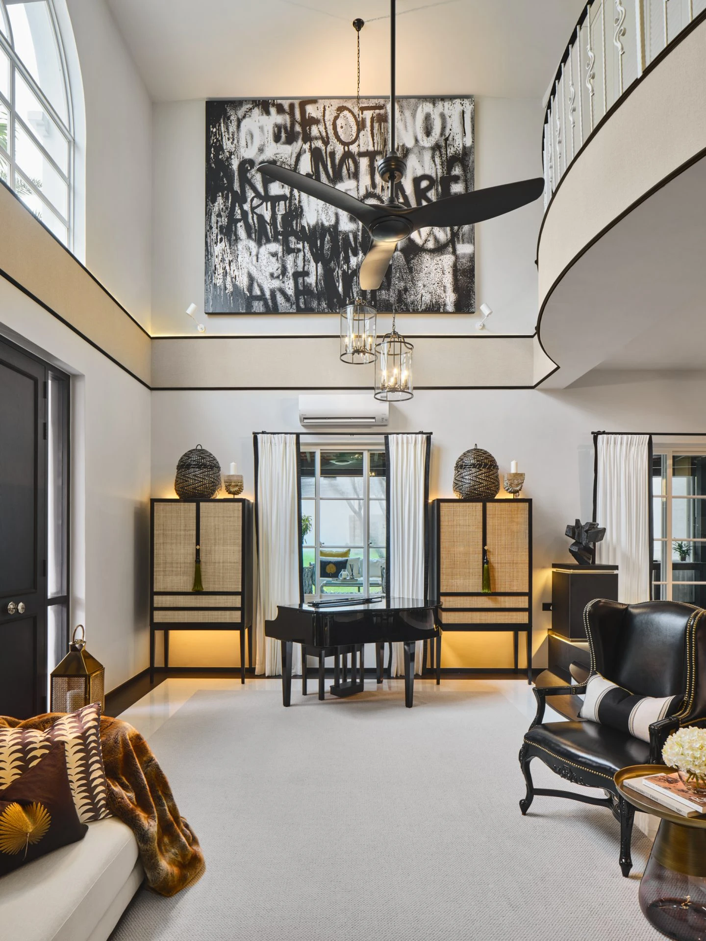 Dining room with crystal chandelier and dark contemporary furniture