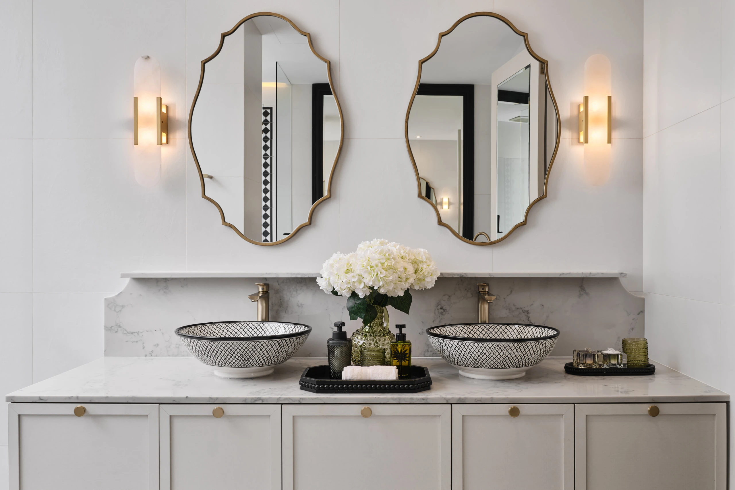 Master bathroom with marble vanity and pendant lighting