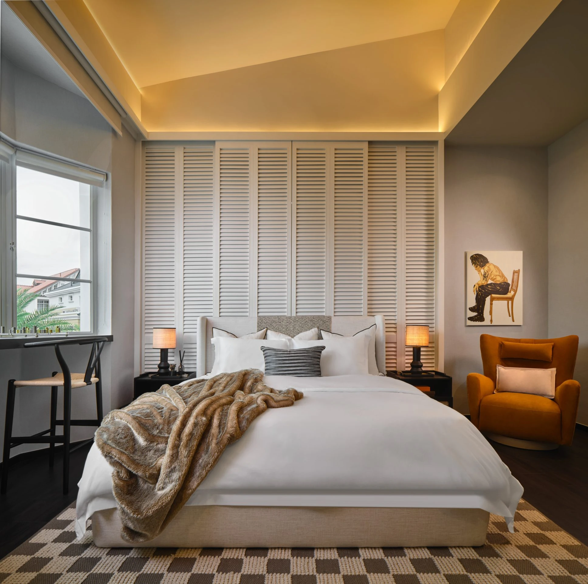 Master bedroom with custom wooden headboard and warm ambient lighting