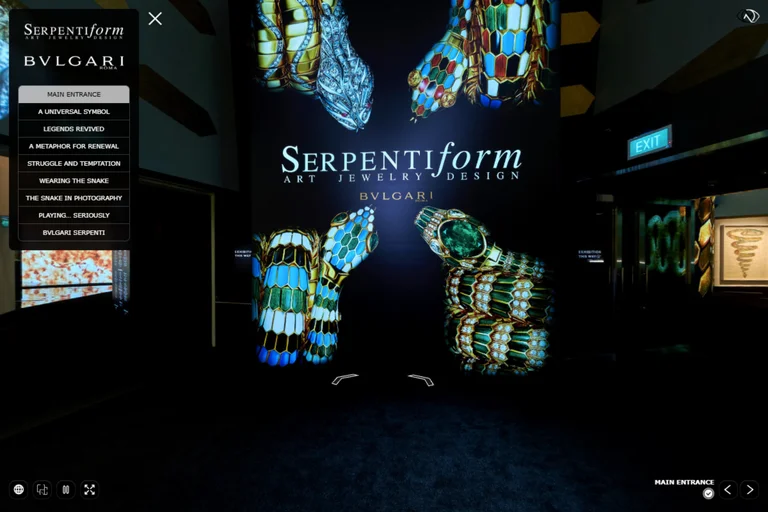 Virtual tour entrance showing large backlit wall graphic of jewelled snake bracelets with exhibition title and navigation menu