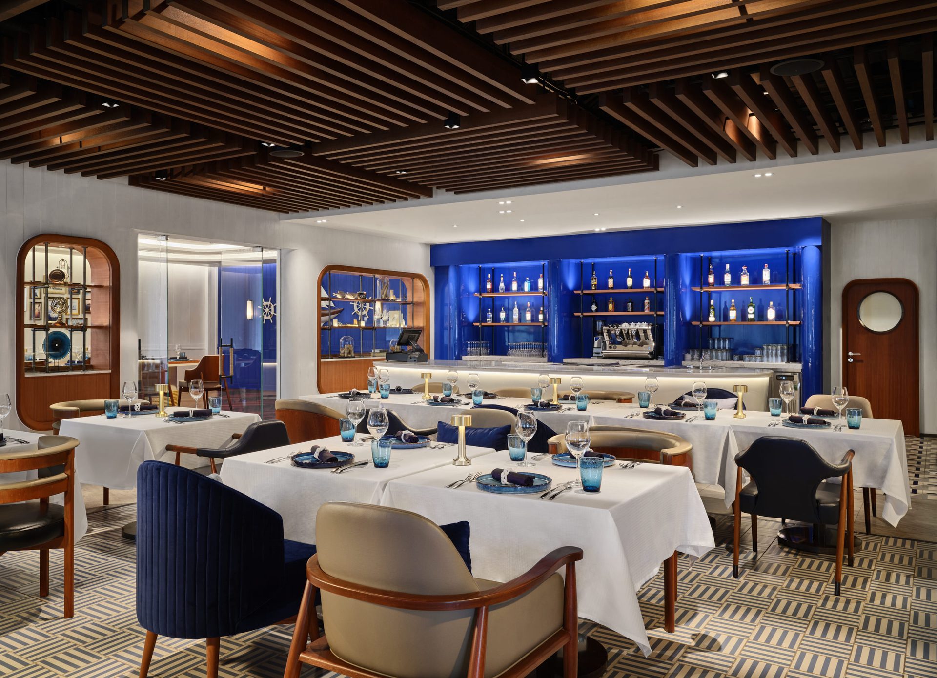 Dining room with maritime cabinets, geometric tiles and wooden lattice — Siam Yacht Club Bangkok interior photography