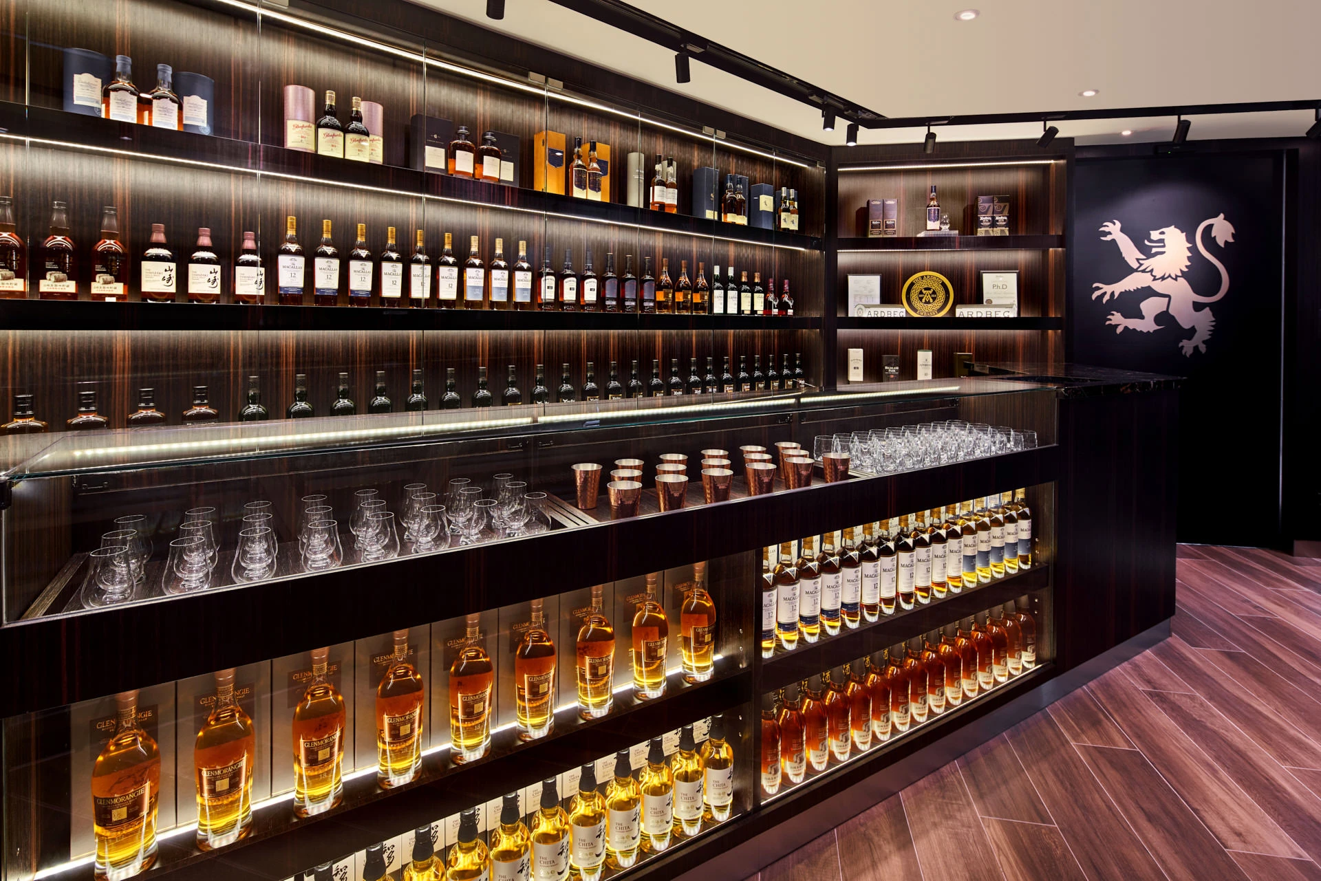 Tasting bar with ebony panelling, Glencairn glasses and backlit shelving