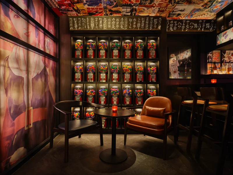 Entrance detail with vintage gumball machines and neon lighting