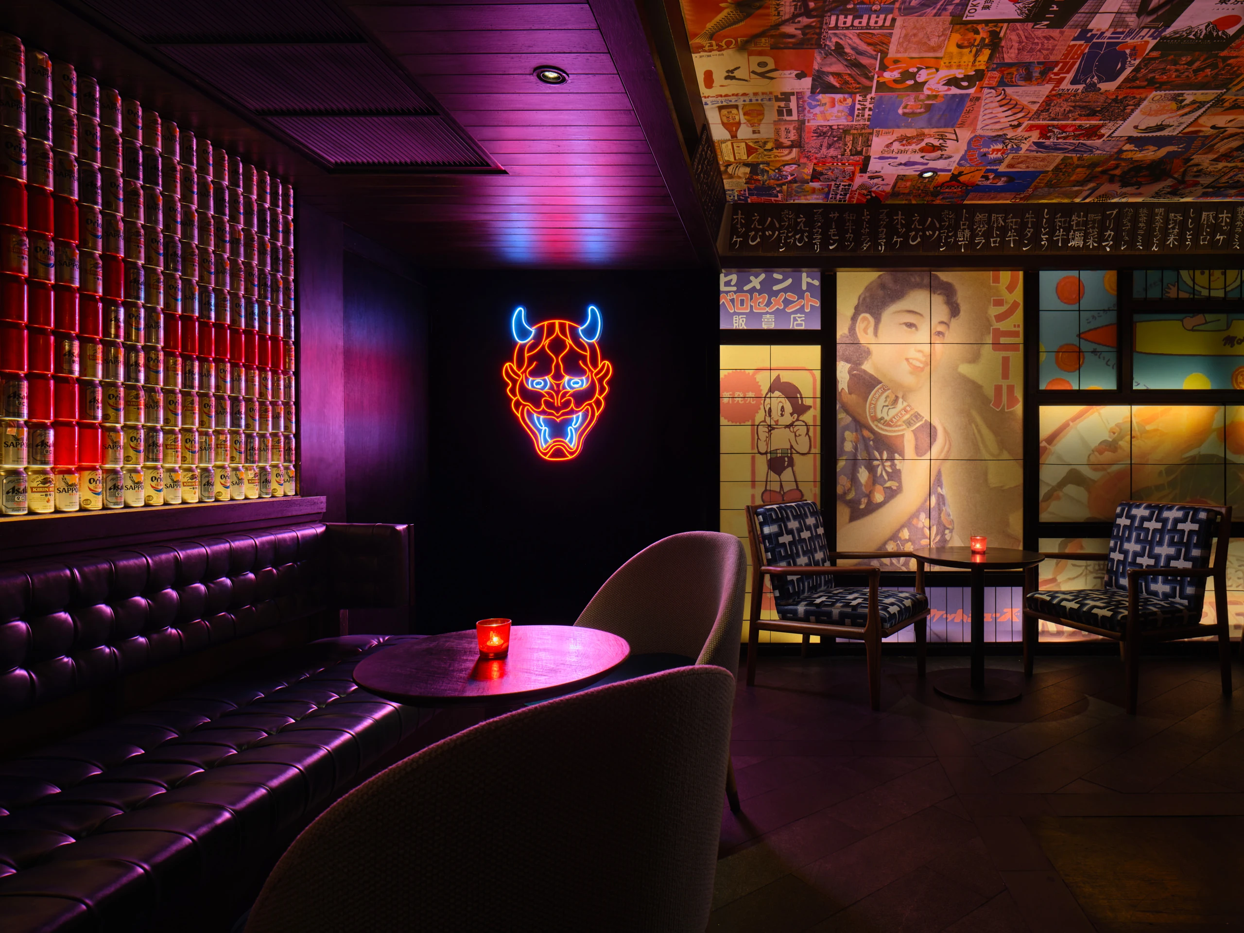 Curved banquette with patterned upholstery and magazine-clipping wall collage