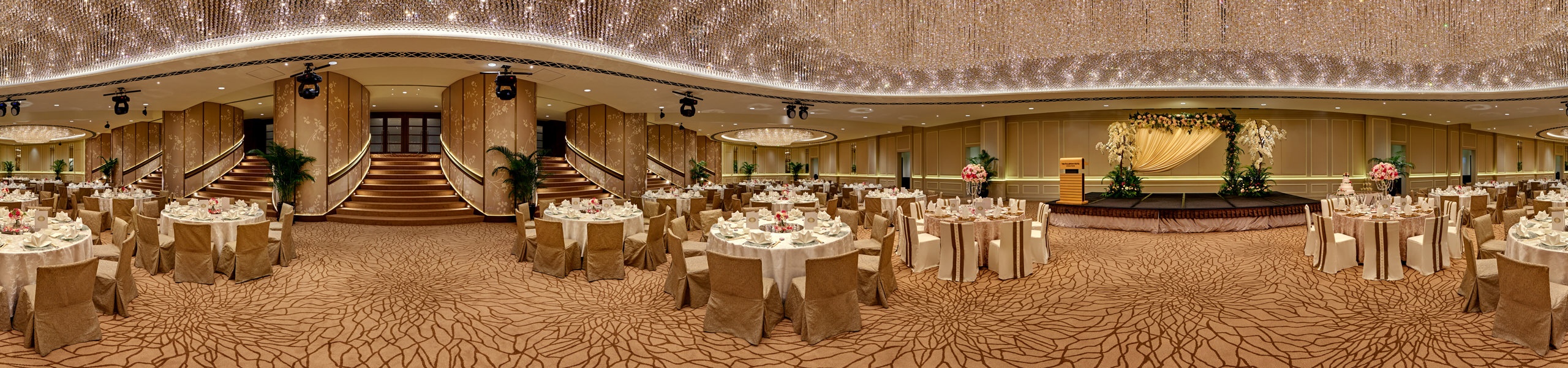 360 panorama of The Fullerton Hotel Singapore ballroom with crystal chandelier ceiling, wedding banquet tables and grand staircase