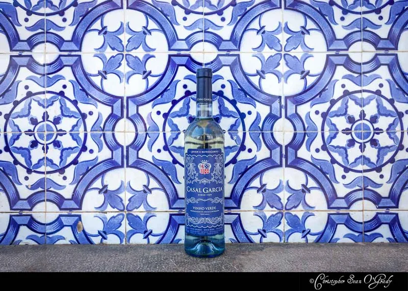 Casal Garcia Vinho Verde on a ledge with Portuguese blue azulejo tiles